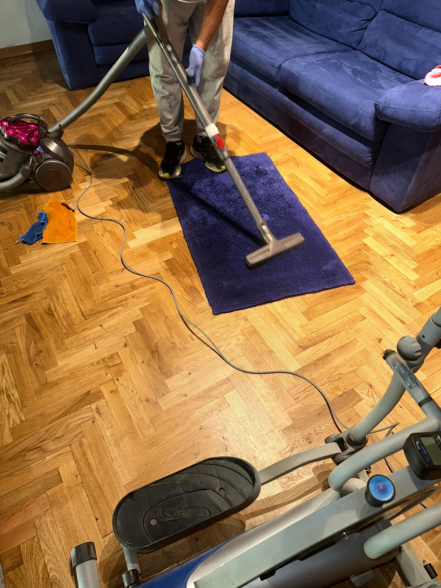 Vacuuming a rug during a STaR Cleaning visit